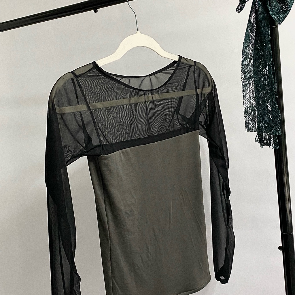 A mesh or fishnet top photographed for a US retail listing in September 2026